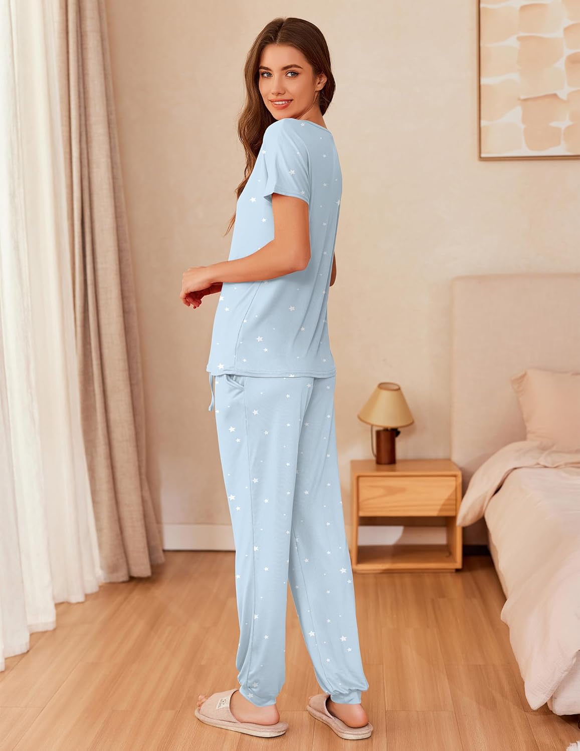 Light blue star-print pajama set with short sleeves and loose jogger-style pants, side view