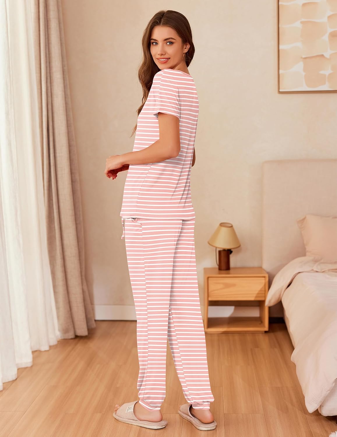 Pink and white striped short-sleeve pajama set with relaxed pants, side view