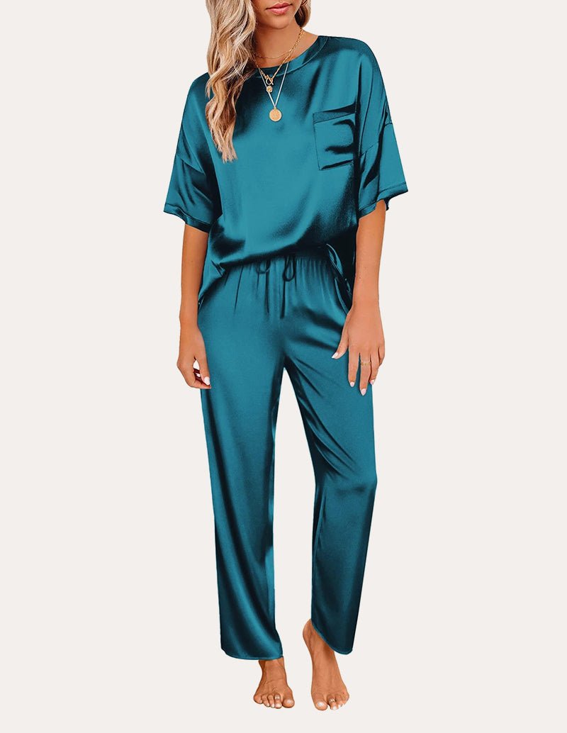 Blue satin pajama set: short-sleeve top with chest pocket and drawstring-waist lounge pants.