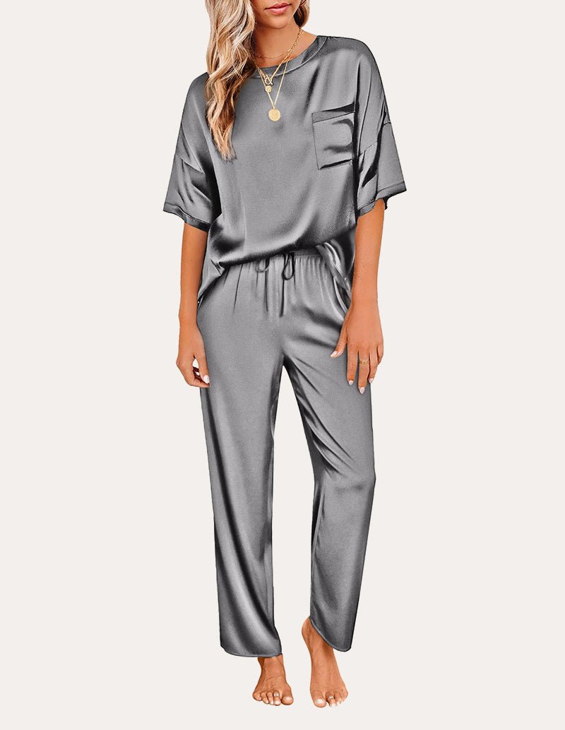 Dark gray satin pajama set: short-sleeve top with chest pocket and drawstring waist pants.