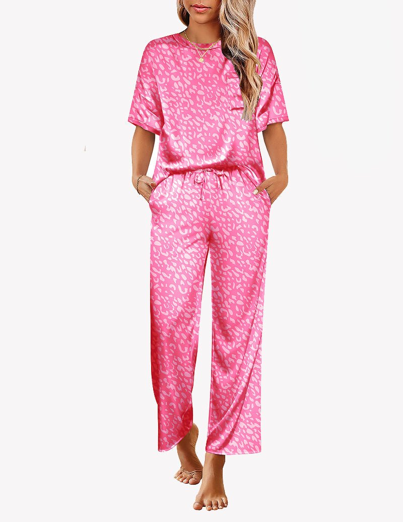 Pink satin pajama set with allover leopard print, short-sleeve top and wide-leg pants