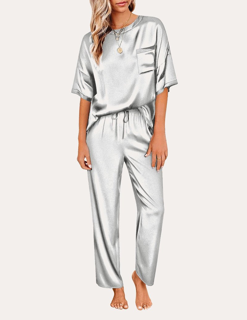 Light gray satin pajama set: short-sleeve top with chest pocket and drawstring waist pants.