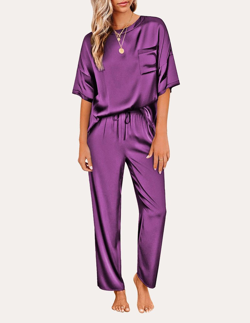 Purple satin pajama set with short sleeves: chest pocket top and drawstring waist pants.