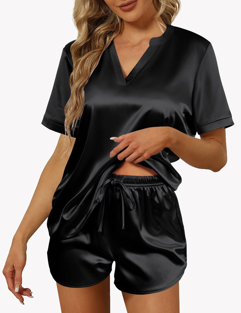 Black satin pajama set with V-neck, short sleeves, and drawstring shorts