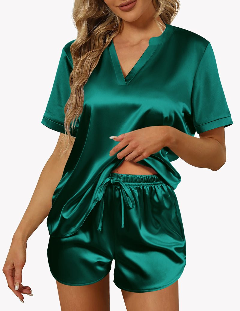 Dark green satin pajama set with V-neck, short sleeves, and drawstring shorts