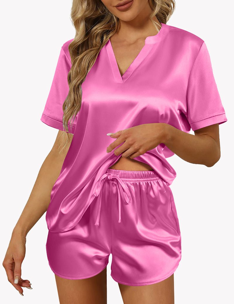 Pink satin pajama set with V-neck, short sleeves, and drawstring shorts