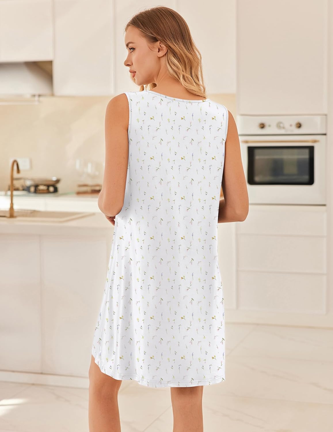 White sleeveless nightgown with small botanical print, shown from the back