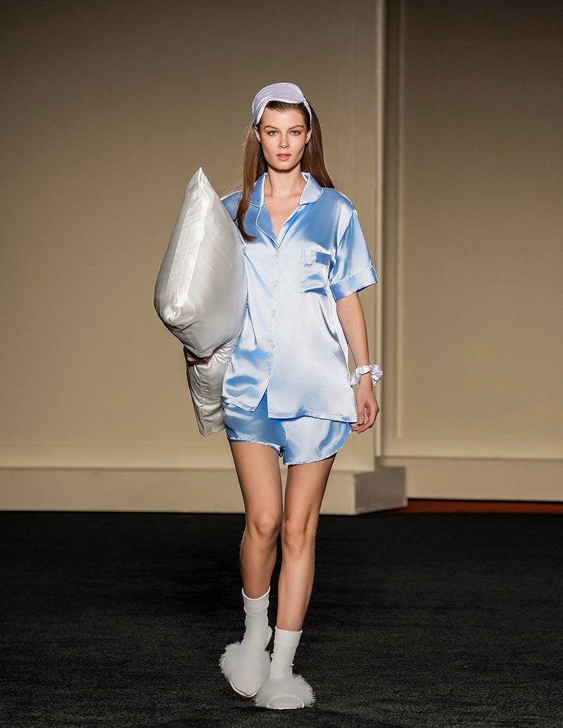 Satin pajama set in light blue: short-sleeve button top with matching shorts