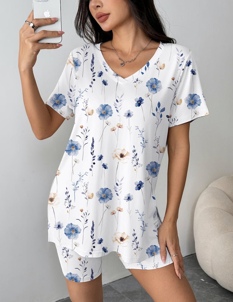 White pajama set with blue flower print V-neck top and matching biker shorts