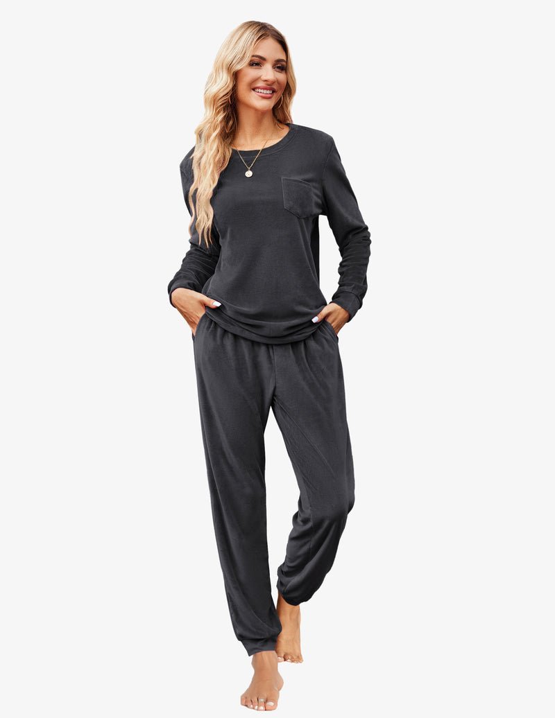 Grey velour tracksuit set with long-sleeve top pocket and relaxed cuffed jogger pants.