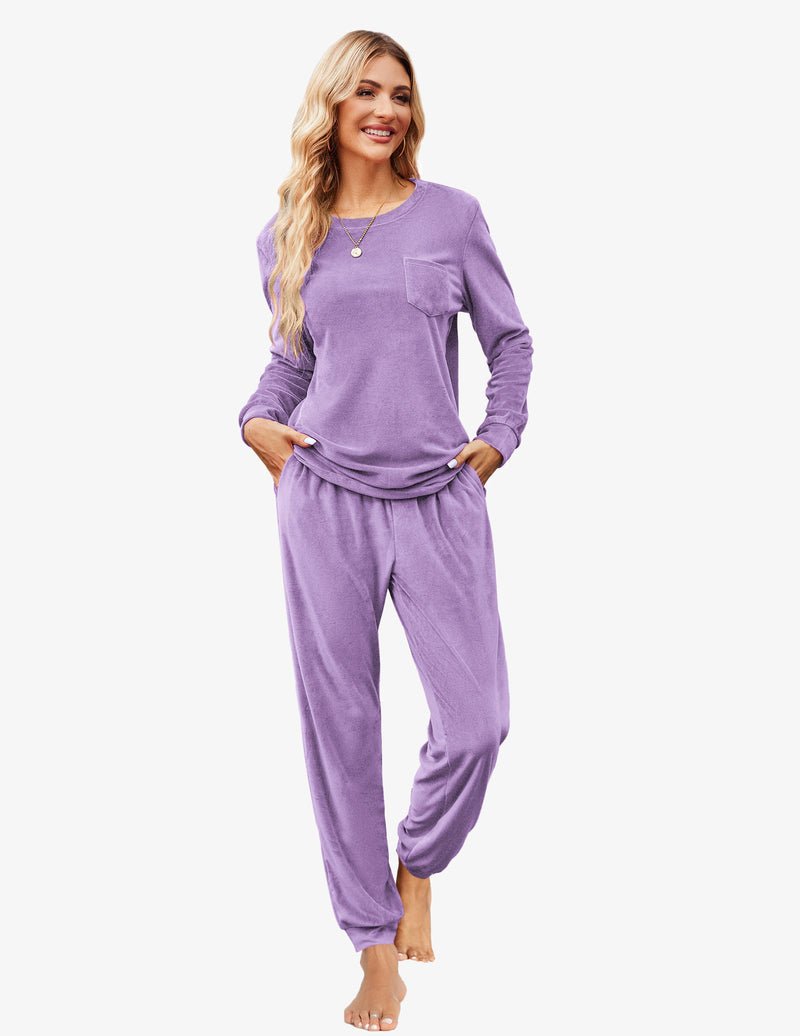 Light purple velour tracksuit set: crewneck top pocket with drawstring jogger pants.