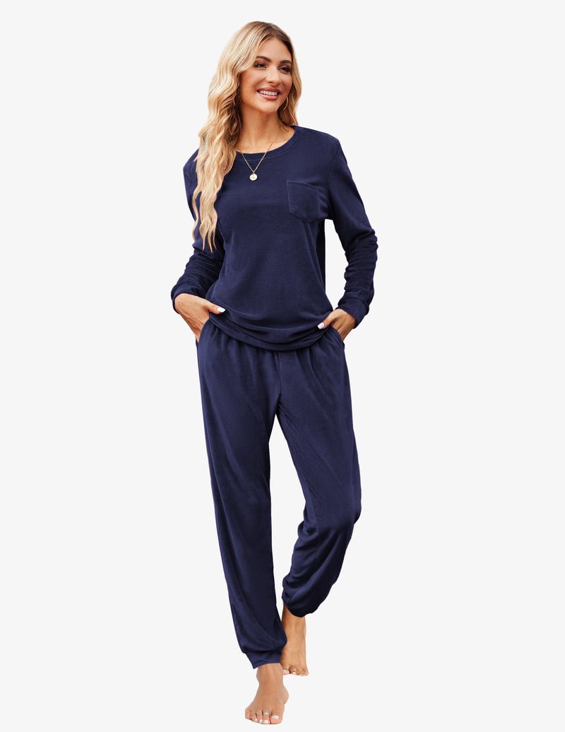 Navy blue velour tracksuit set: long-sleeve top pocket with cuffed jogger pants.