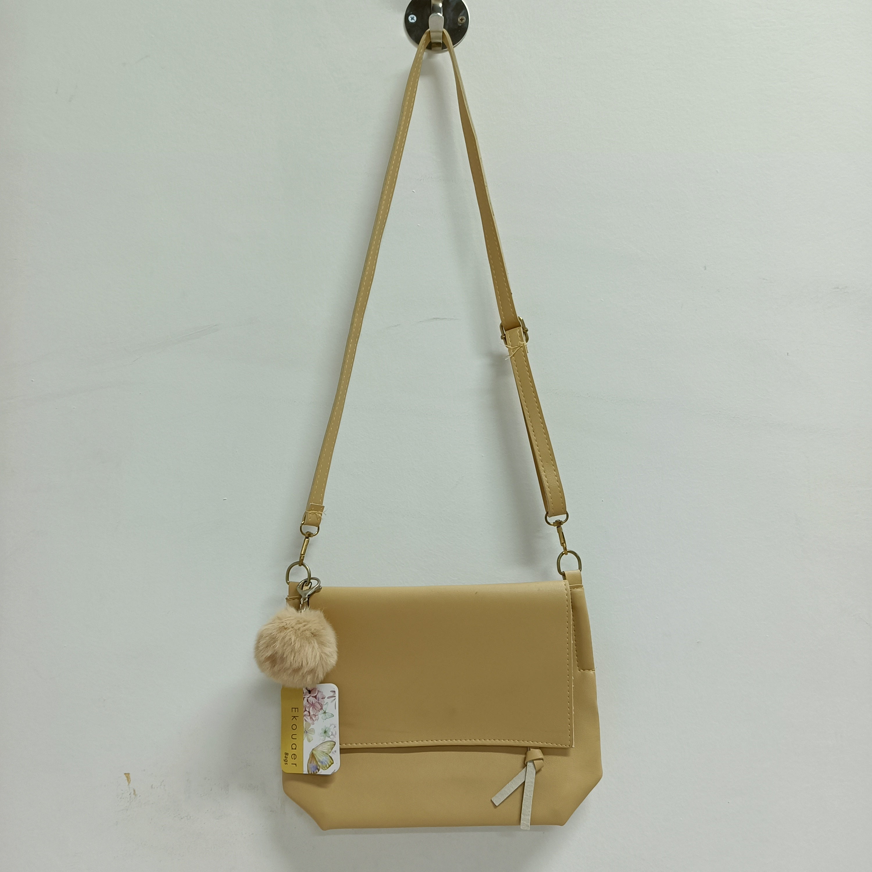 Ekouaer crossbody bag with long adjustable straps and pom-pom charm