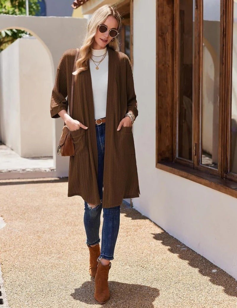 Brown waffle robe with V-neck, tie waist, 3/4 sleeves over jeans
