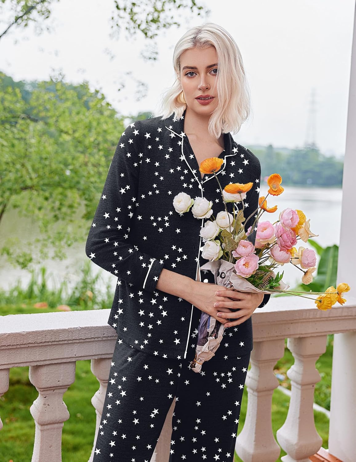 Black pajama set with small white star print, button-down top and matching pants