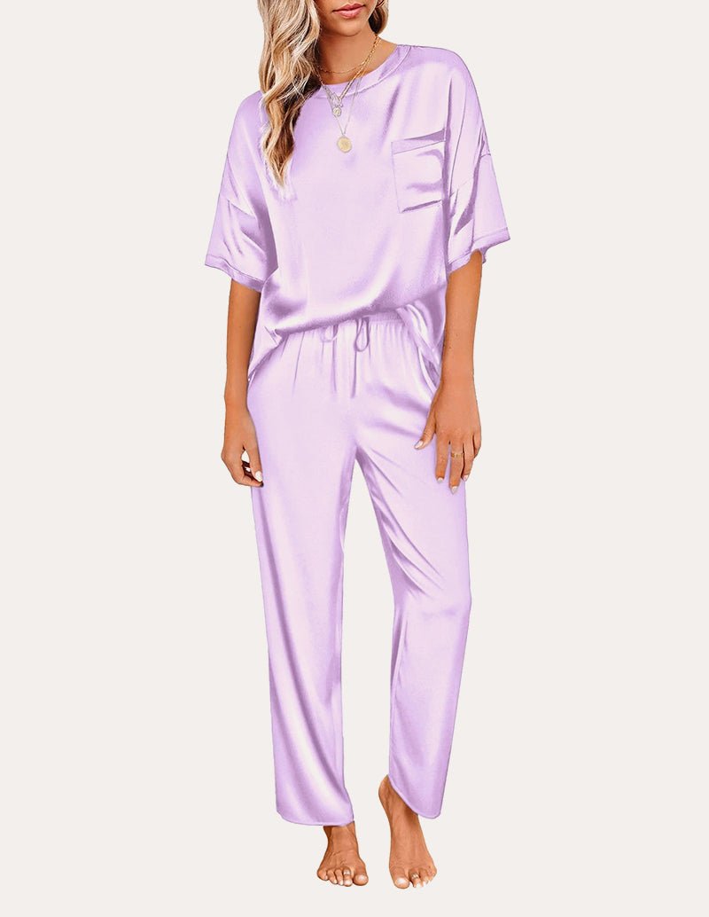 Light purple satin pajama set: short-sleeve top with chest pocket and drawstring waist pants.
