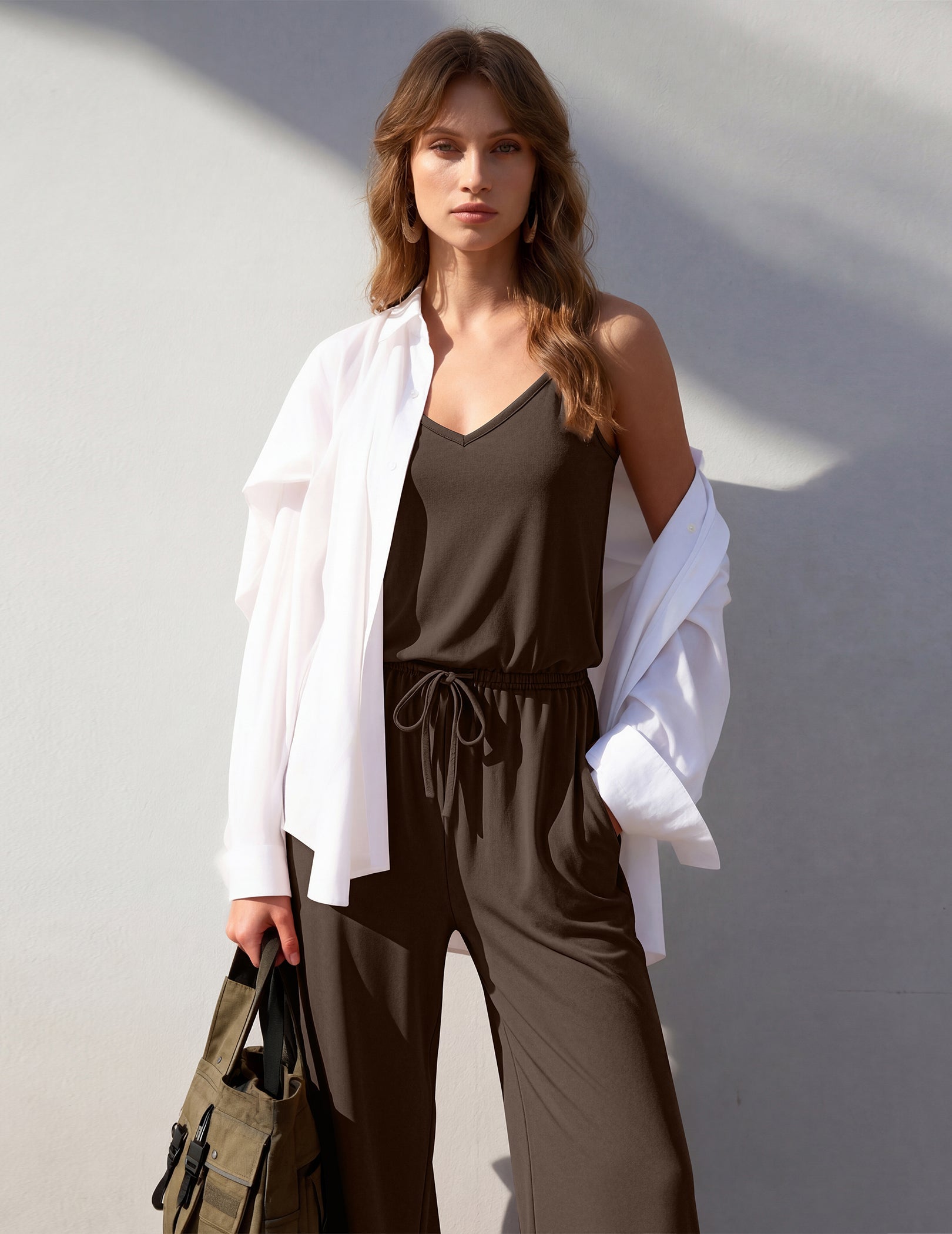 Brown sleeveless wide-leg jumpsuit with V-neck, drawstring waist and side pockets