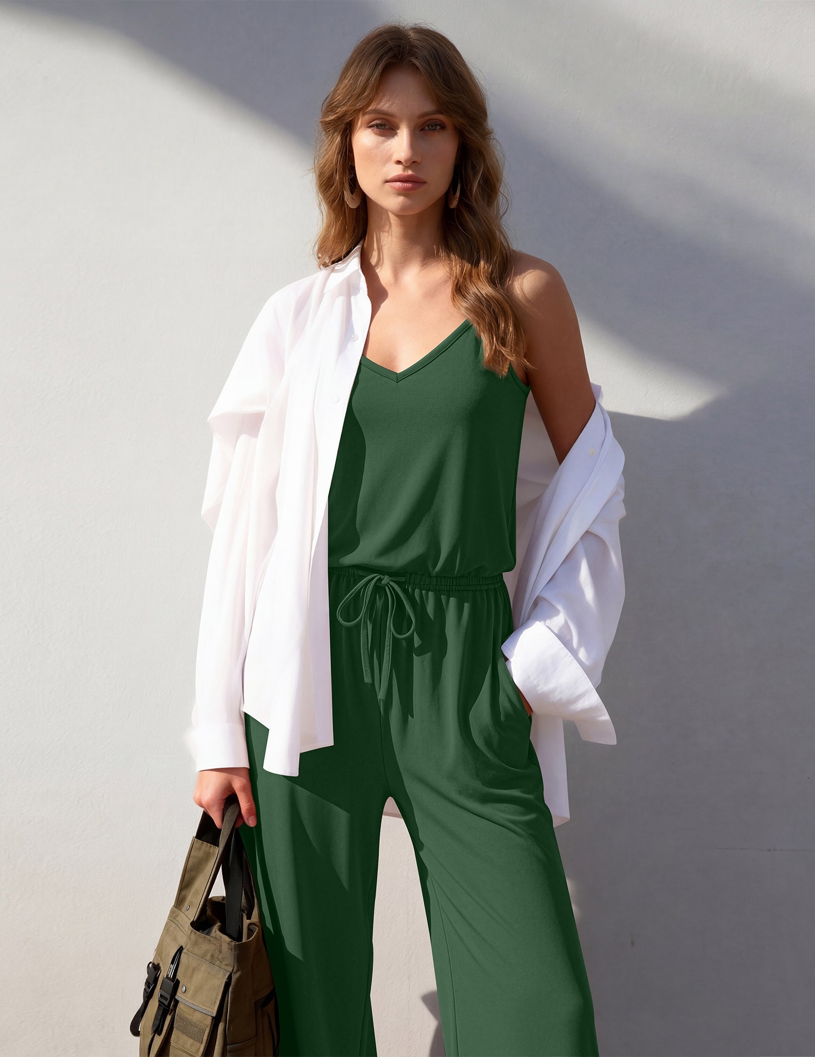 Green sleeveless wide-leg jumpsuit with V-neck, drawstring waist and side pockets