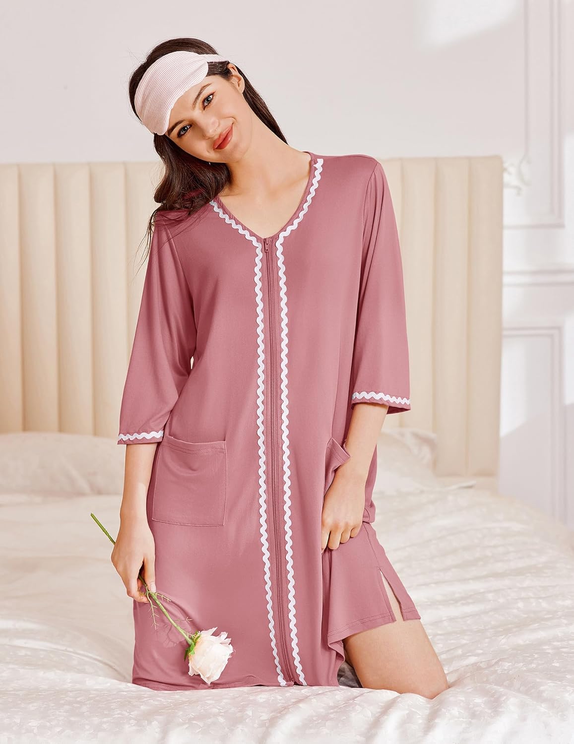 Zipper-Robe rosa mit Kontrastbesatz, 3/4-Ärmeln und Tasche auf der Vorderseite