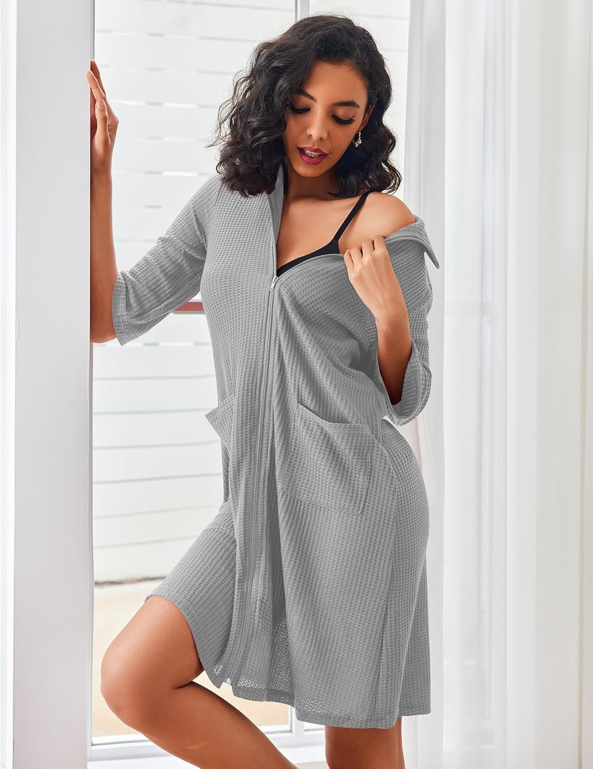 Light gray waffle-knit zip bathrobe with pockets and hood, long sleeves