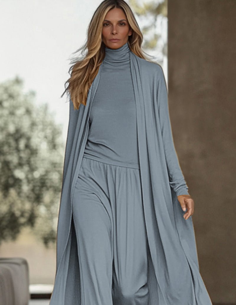 Blue long-sleeve turtleneck maxi dress with layered skirt and matching pants