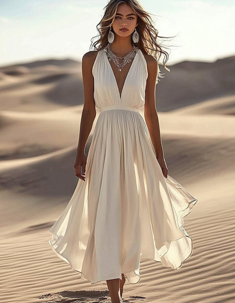 White sleeveless deep V-neck midi dress with gathered waist and flowing layered skirt.