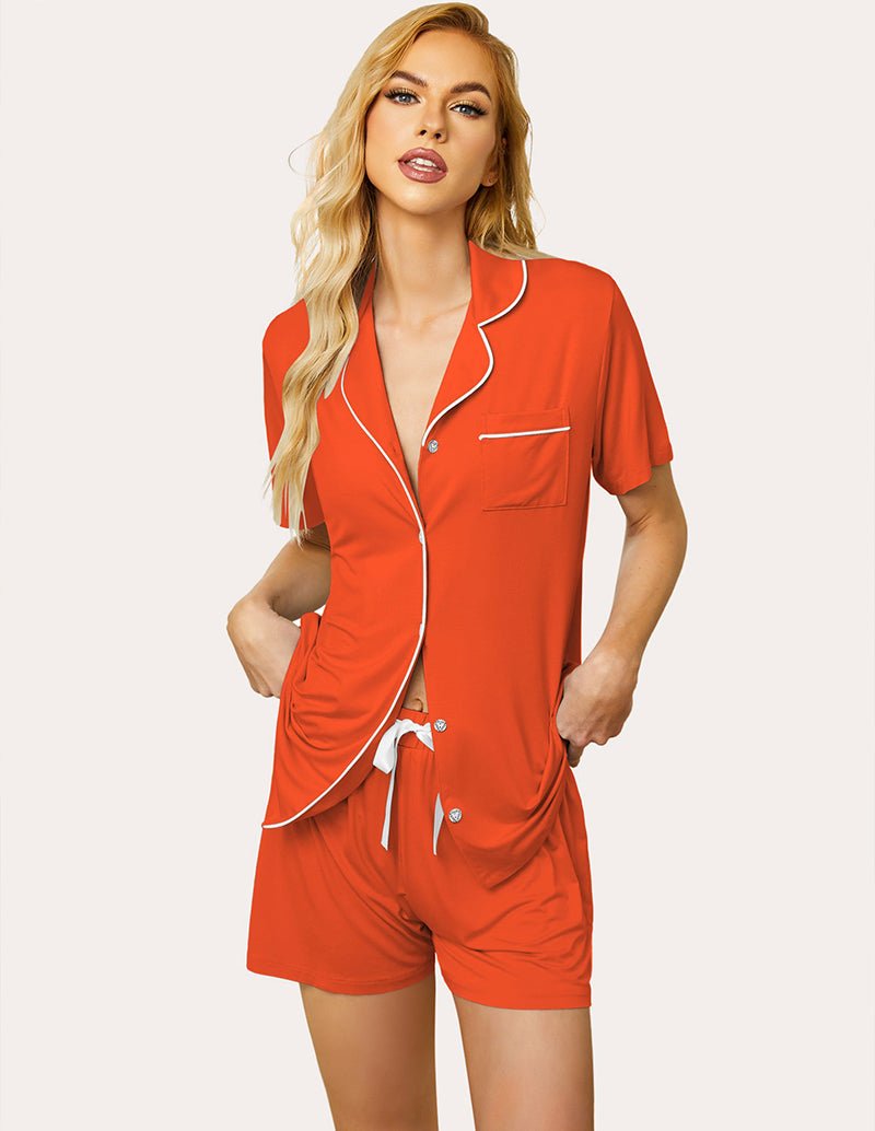 Orange pajama set with short-sleeve button shirt and drawstring shorts, contrast trim