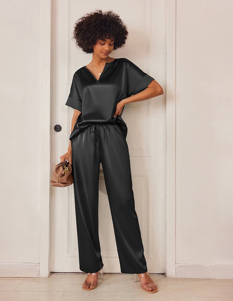 Black satin V-neck pajama set with short sleeves and drawstring wide-leg pants