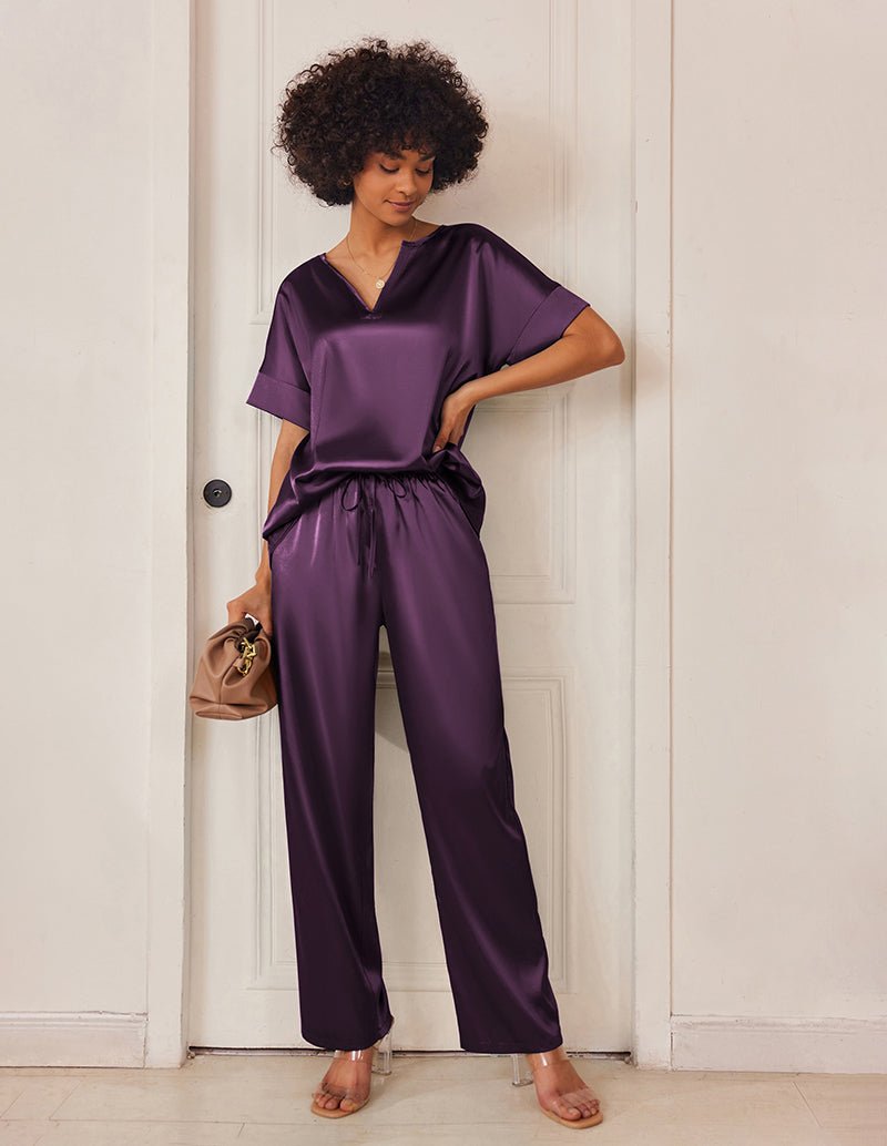 Dark purple satin V-neck pajama set with short sleeves and drawstring wide-leg pants