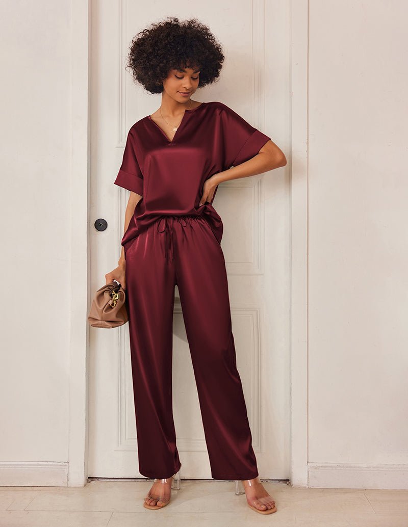 Burgundy satin V-neck pajama set with short sleeves and drawstring wide-leg pants