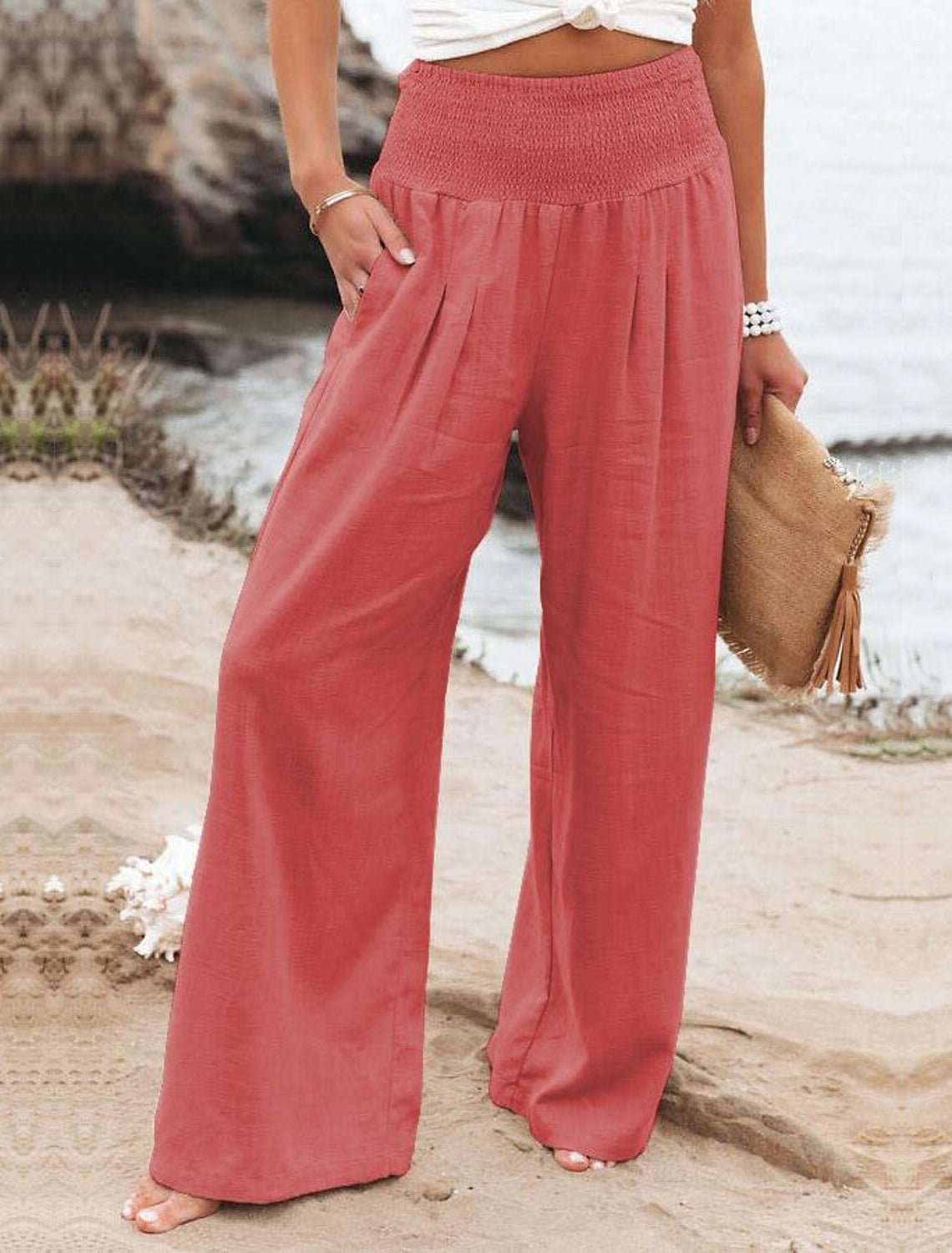 Pink cotton wide-leg lounge pants with elastic smocked waistband and flowing pleats
