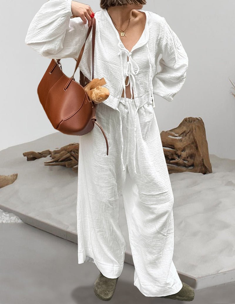 White cotton lounge set with drawstring V-neck top and wide-leg pants, side view