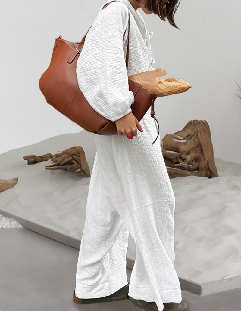 White cotton lounge set with drawstring V-neck top and wide-leg pants, back/side view
