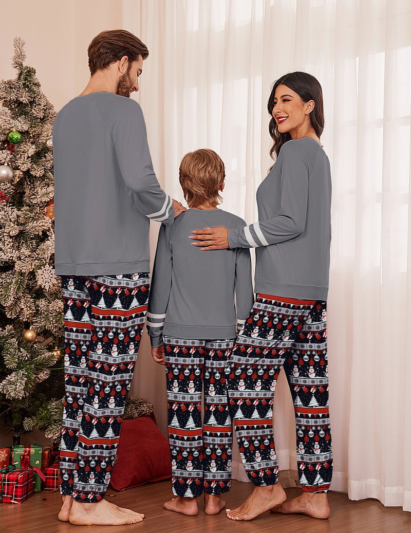 Back view of matching grey Christmas pajama set, striped cuffs and patterned pants