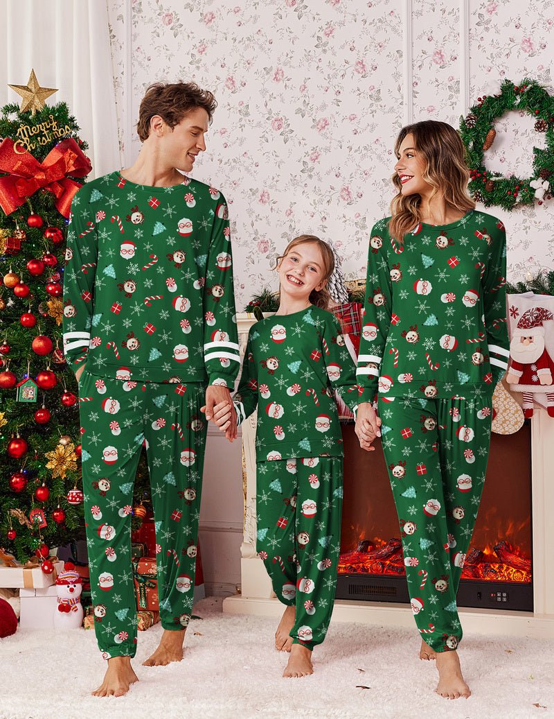 Family matching Christmas pajama set in green with cartoon characters, festive print