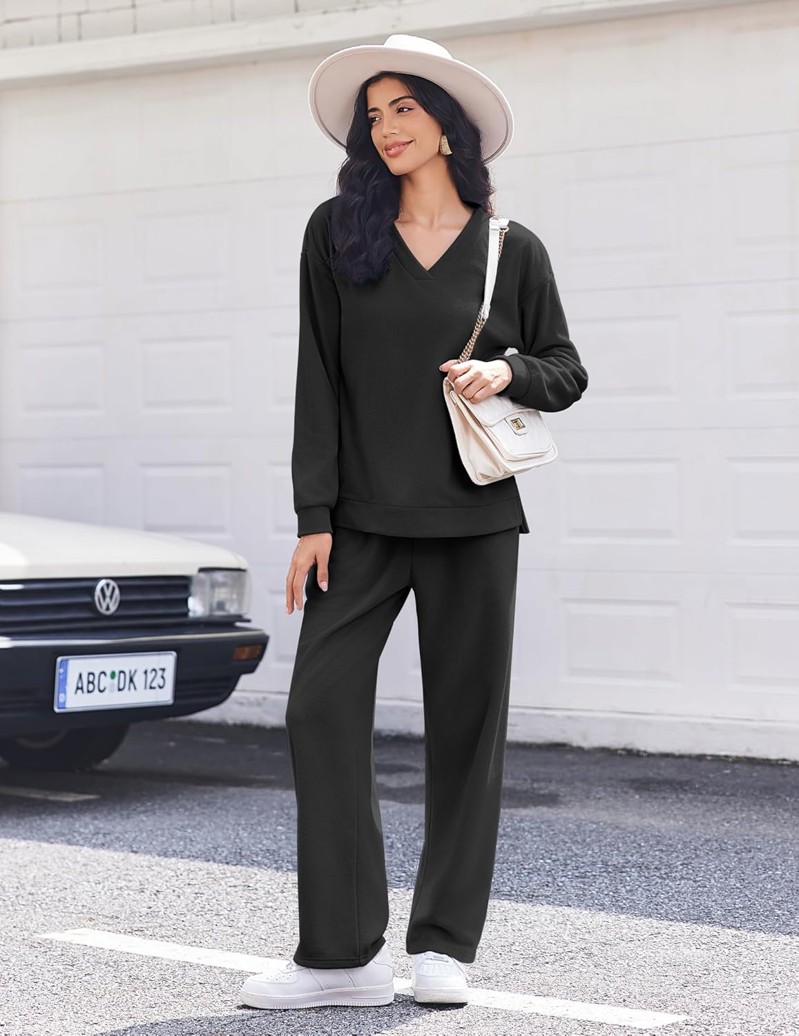 Black fleece long-sleeve lounge set with V-neck top and matching wide-leg pants, front view