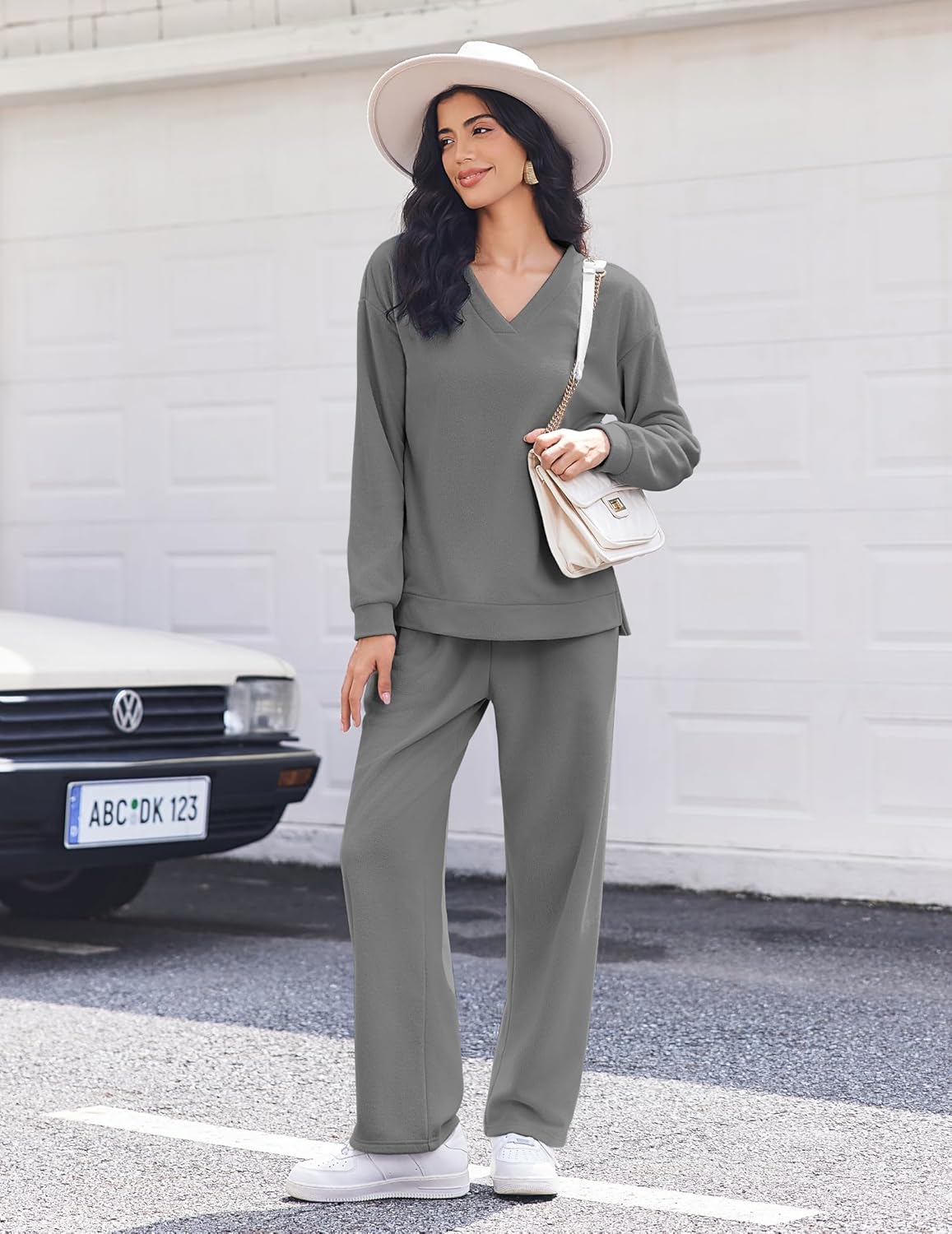 Dark gray fleece V-neck long-sleeve lounge set with wide-leg pants, standing pose