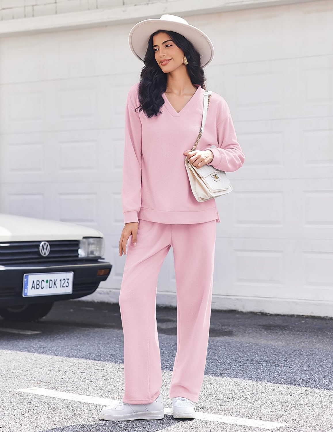 Pink fleece long-sleeve lounge set with V-neck top and matching wide-leg pants, front view