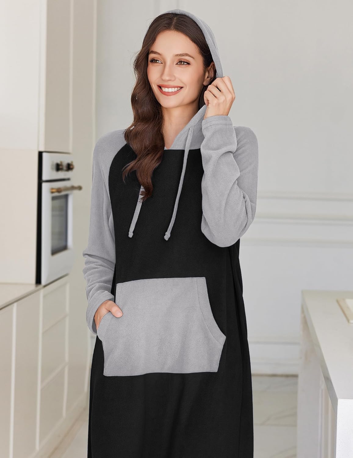 Fleece hooded night gown, black body with gray hood, sleeves, and kangaroo pocket