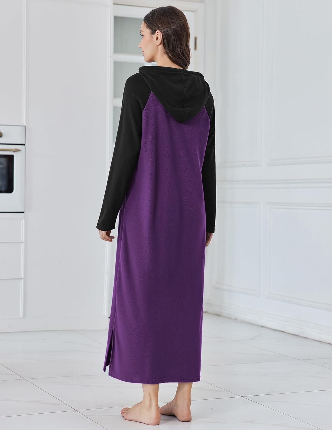 Fleece hooded nightgown, back view with black hood and long sleeves over purple body