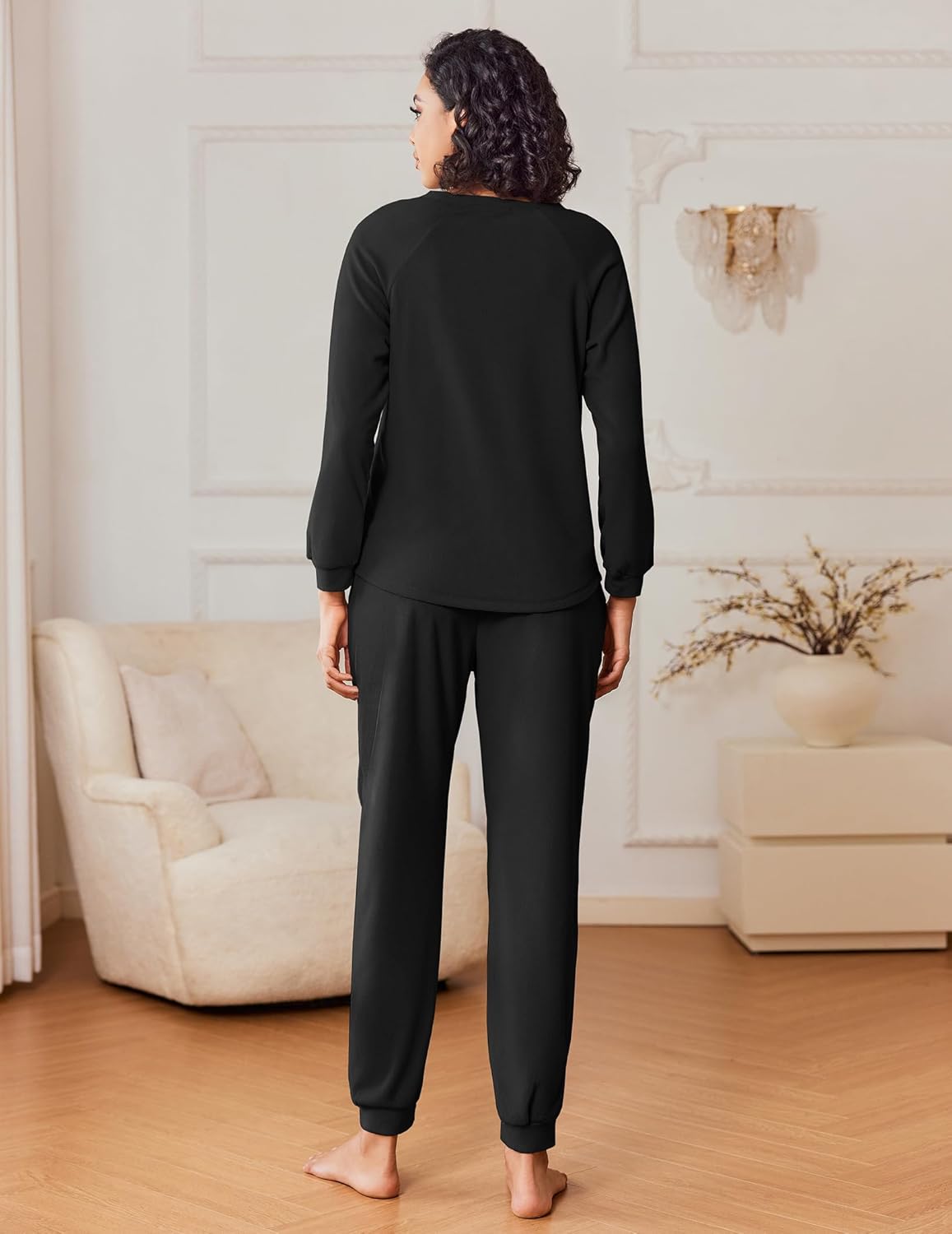 Black fuzzy fleece pajama set, long-sleeve top and jogger pants, back view