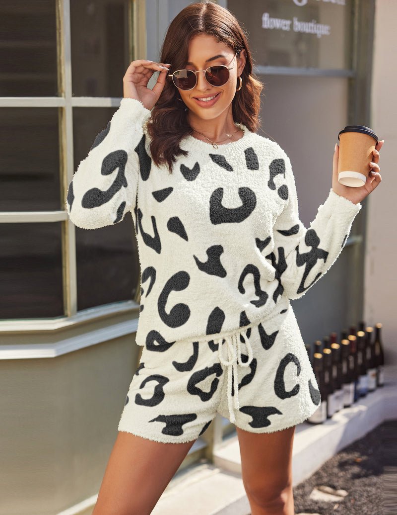 Fuzzy fleece 2-piece pajama set in white with black leopard print; long-sleeve top and shorts