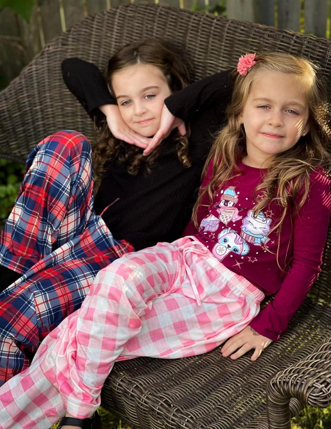 Girls soft pajama pants on child: pink plaid check pattern with elastic waistband