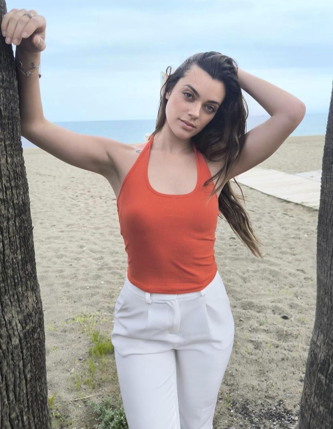 Orange-red ribbed knit halter crop top, backless, wide scoop neckline