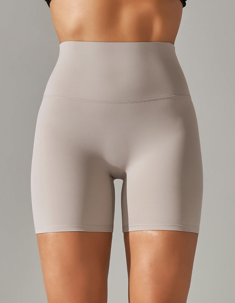 High waist stretch yoga shorts, light gray, fitted with wide waistband and seam.
