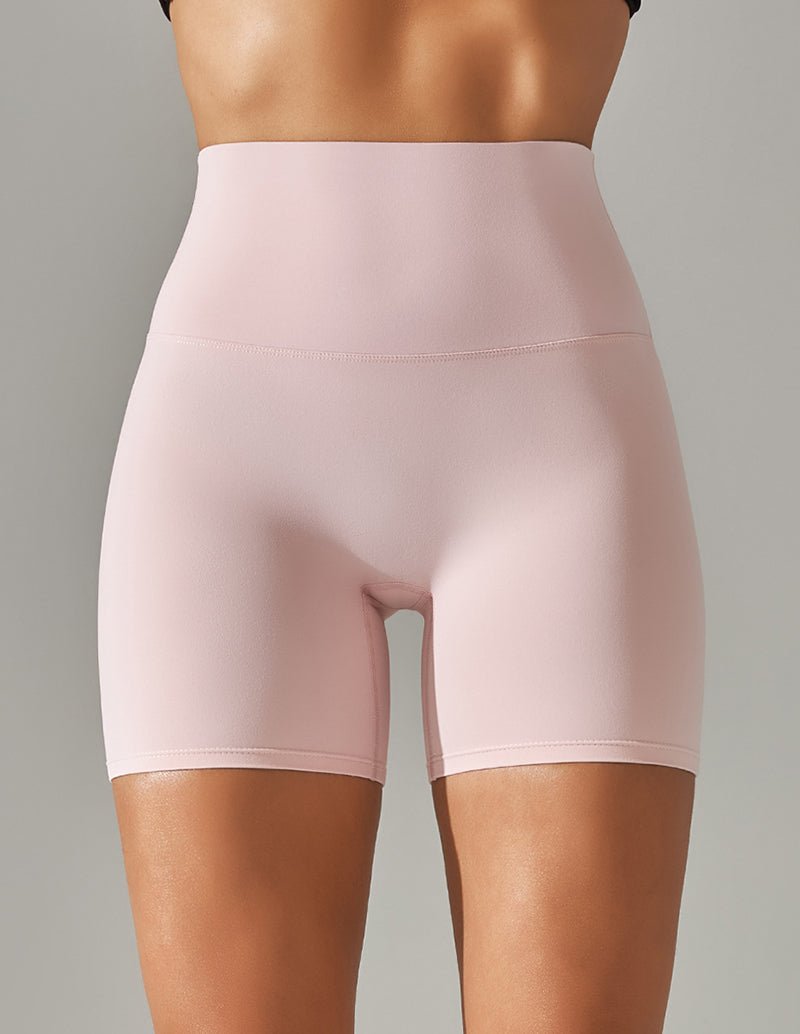 Light pink high-waist stretch yoga shorts with smooth front panel