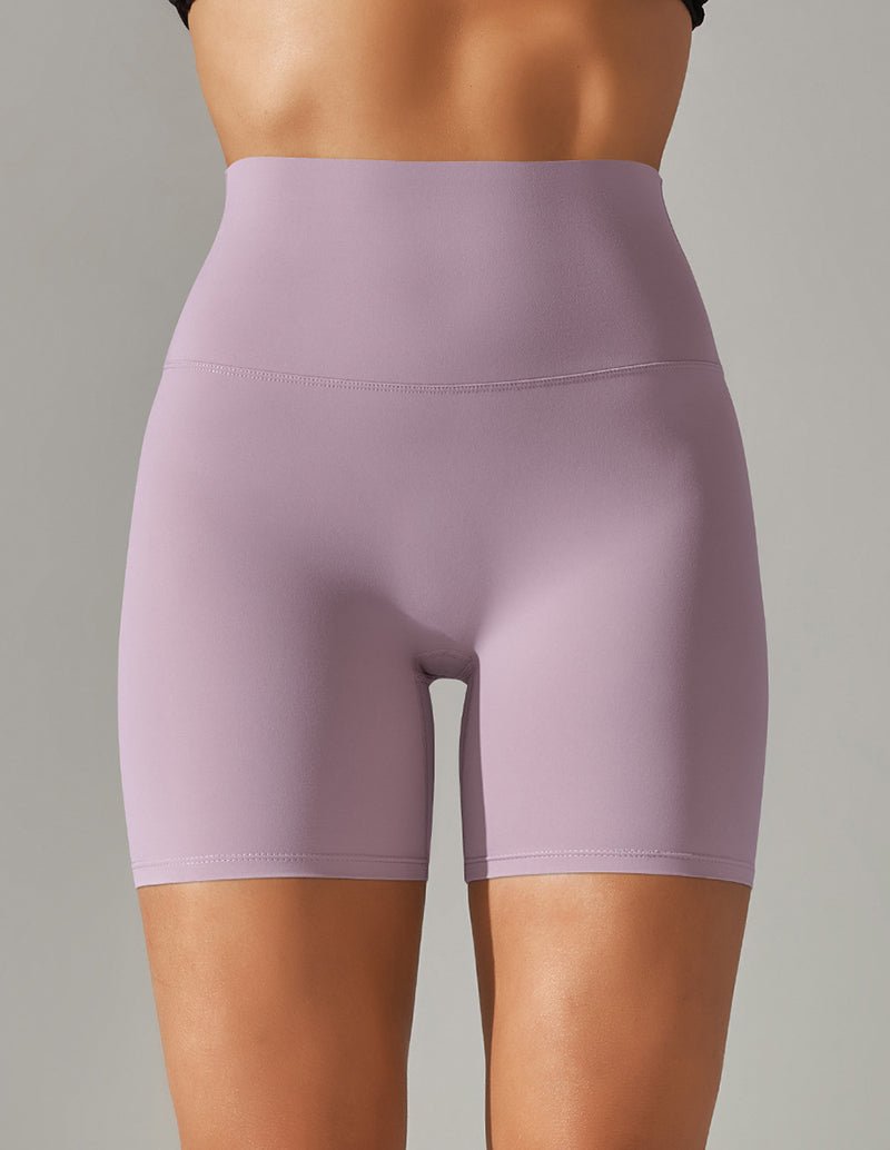 High waist stretch yoga shorts, light purple, fitted with wide waistband and seam.