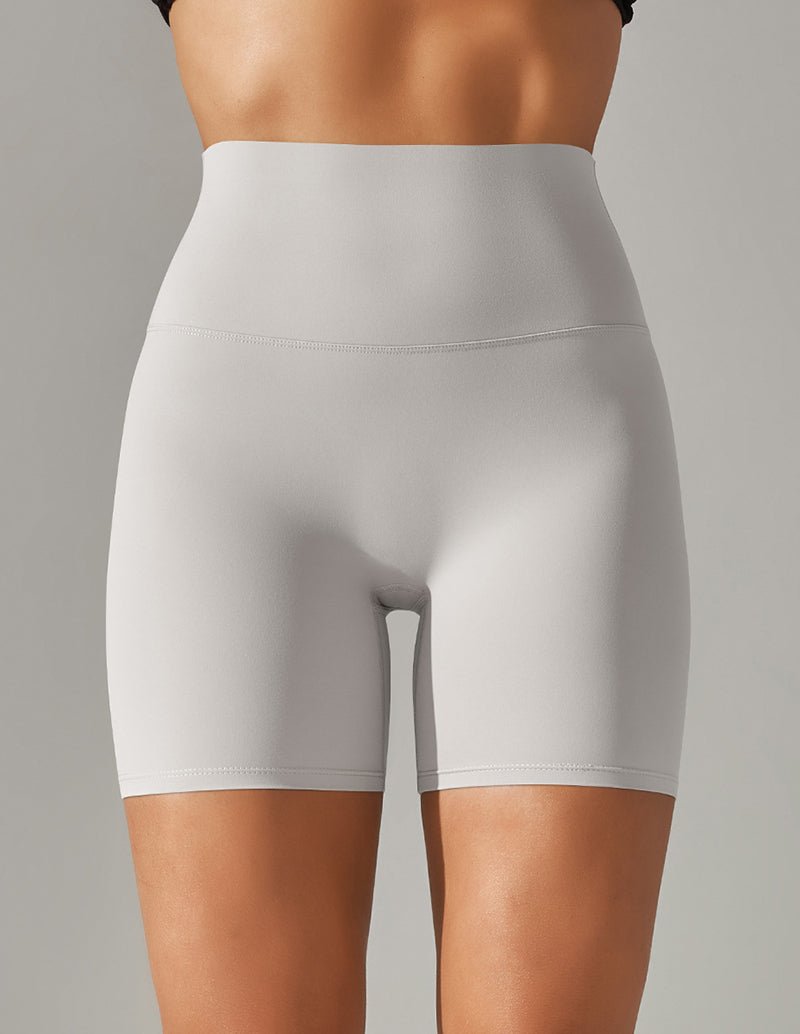 High-waisted yoga shorts, white stretch fabric