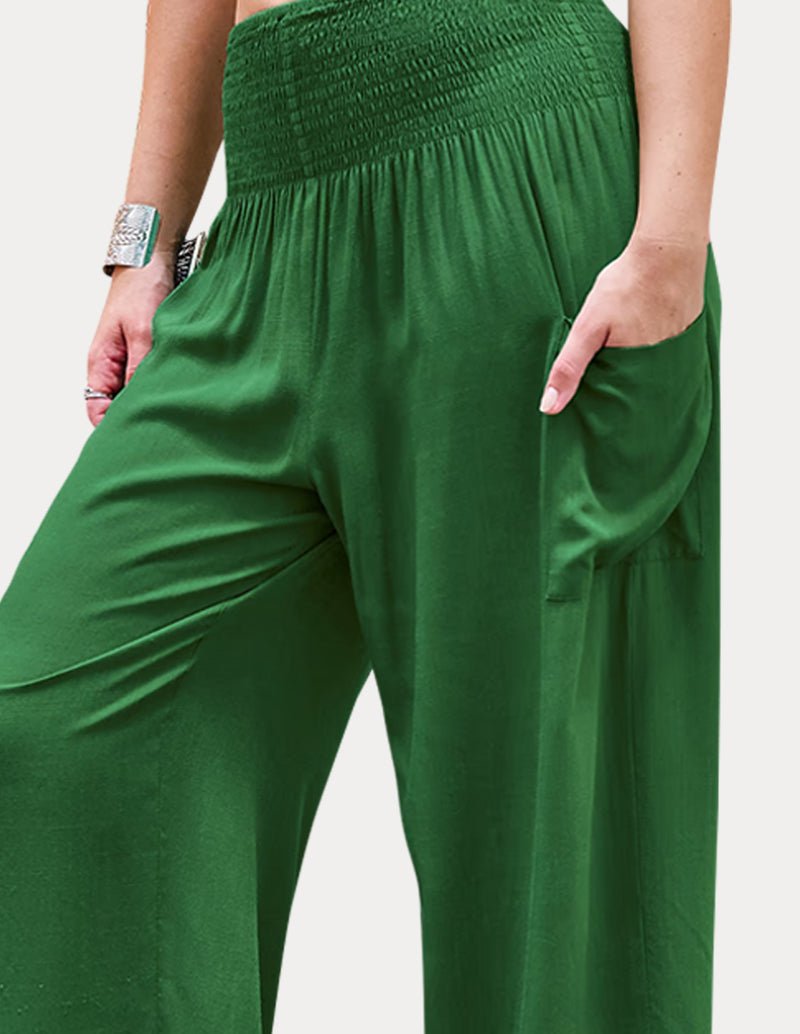 Green high-waisted lounge pants with smocked waistband and side pocket