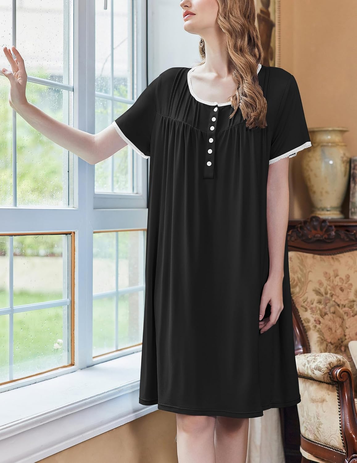 Black muumuu nightgown with short sleeves and button placket, flowy A-line fit